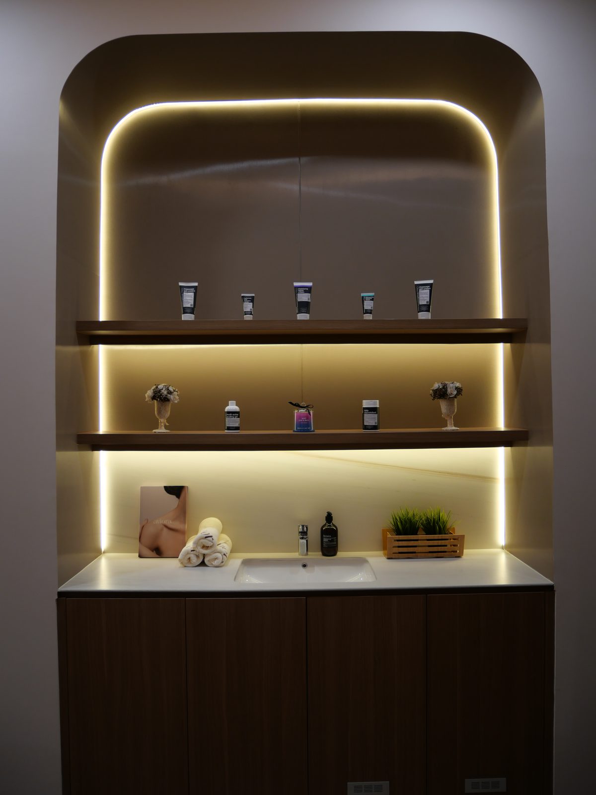 Backlit display shelf holding the clinic's product line